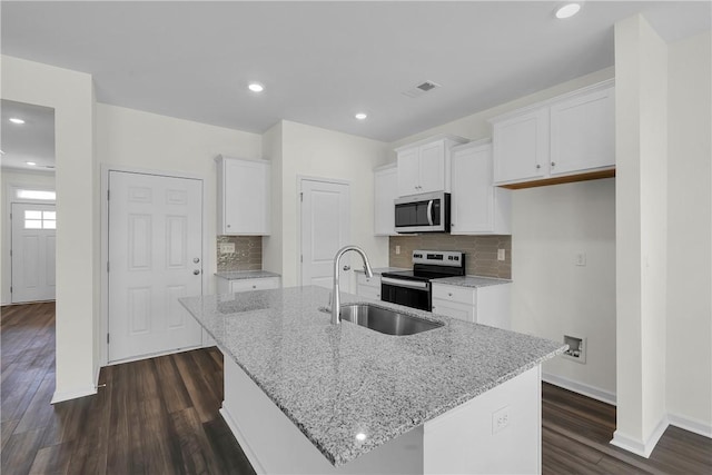 kitchen featuring a sink, white cabinets, stainless steel appliances, and dark wood finished floors