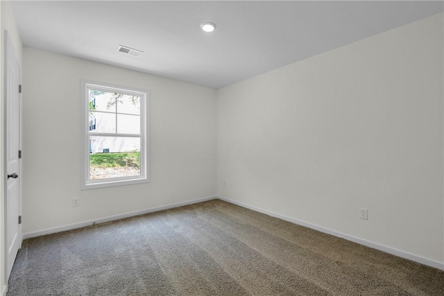 carpeted empty room with visible vents, recessed lighting, and baseboards