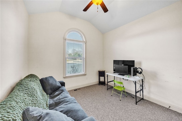 carpeted office with vaulted ceiling, visible vents, a ceiling fan, and baseboards