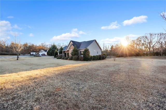 view of property exterior with a yard