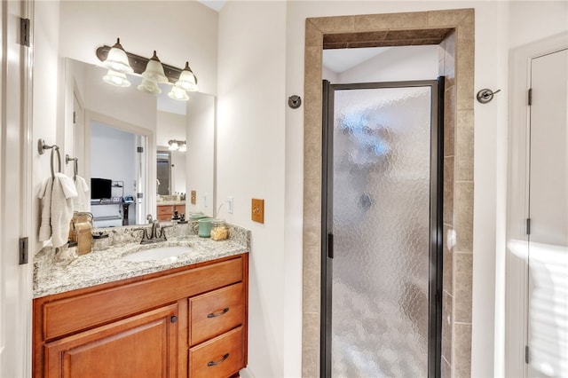 full bathroom featuring a stall shower and vanity