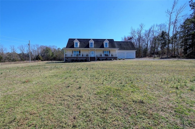 cape cod-style house with an attached garage and a front yard