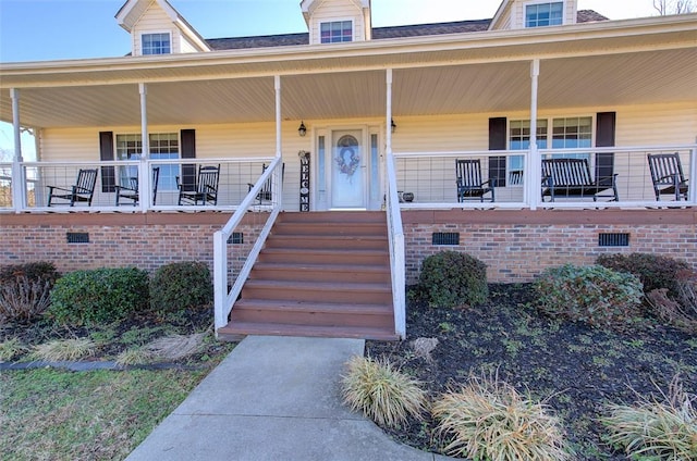 property entrance featuring a porch and crawl space