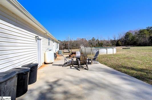 view of patio with an outdoor pool