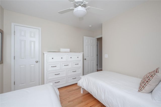 bedroom featuring a ceiling fan and light wood-type flooring