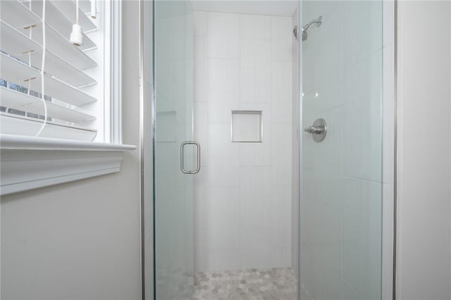 bathroom featuring a shower stall