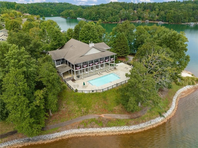 aerial view featuring a water view and a forest view