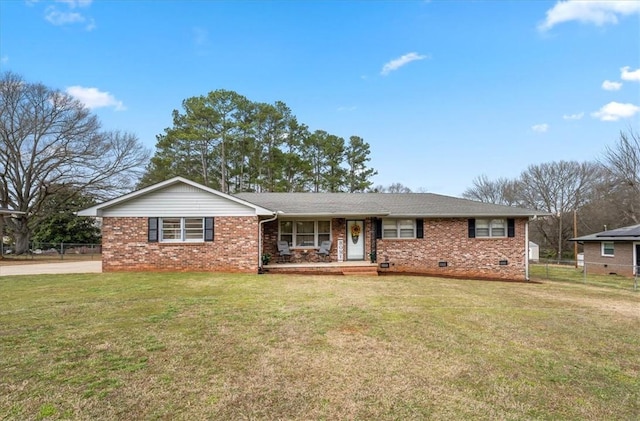 ranch-style house with brick siding, crawl space, a front yard, and fence