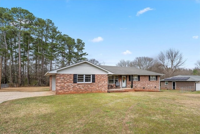 ranch-style house with a porch, crawl space, a front lawn, and concrete driveway