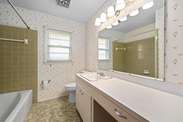 full bath with baseboards, vanity, toilet, and wallpapered walls