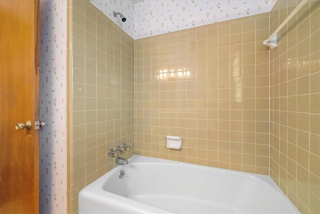 bathroom featuring wallpapered walls and shower / tub combo with curtain