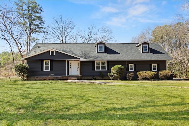 view of front of house with crawl space, a front lawn, and roof with shingles