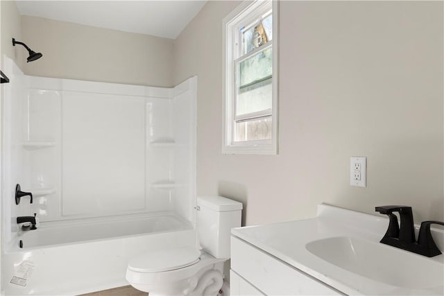 full bathroom with bathtub / shower combination, vanity, and toilet