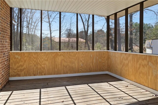 unfurnished sunroom featuring a wealth of natural light