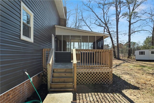 wooden deck with a sunroom