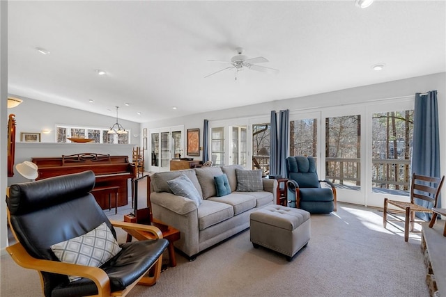 carpeted living room featuring vaulted ceiling, a ceiling fan, and recessed lighting