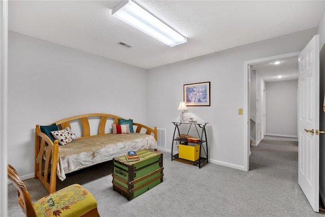 bedroom featuring baseboards, visible vents, and carpet flooring