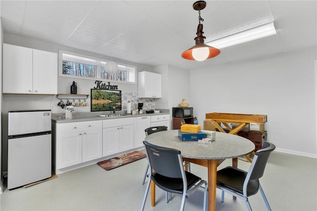 dining space with baseboards