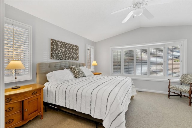 bedroom featuring light carpet, ceiling fan, lofted ceiling, and baseboards