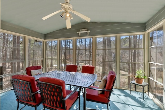 sunroom / solarium featuring vaulted ceiling and a ceiling fan