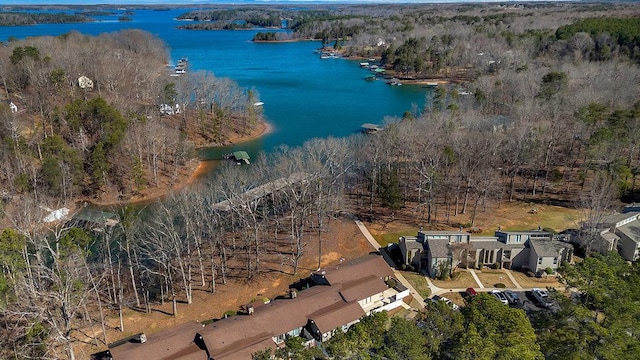 aerial view featuring a water view and a wooded view