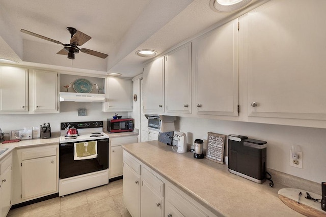 kitchen with range with electric cooktop, light countertops, under cabinet range hood, and open shelves