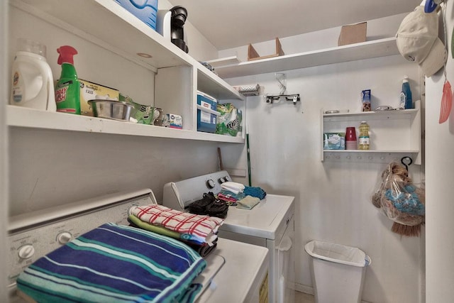 laundry area featuring laundry area and washer and clothes dryer