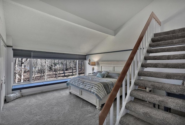 bedroom featuring vaulted ceiling with beams and carpet floors