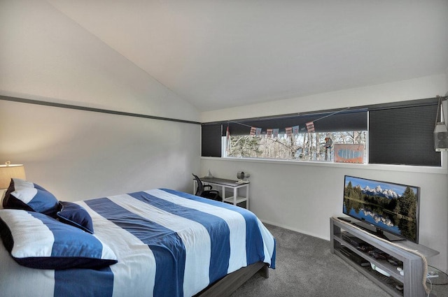 carpeted bedroom with vaulted ceiling