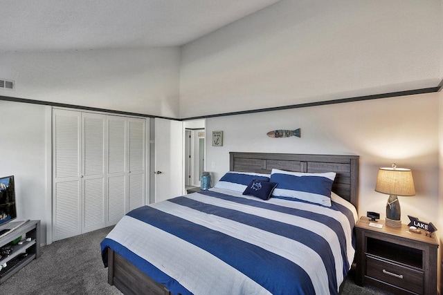 bedroom featuring lofted ceiling, a closet, carpet flooring, and visible vents