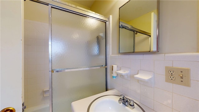 full bathroom featuring a sink, tile walls, and wainscoting