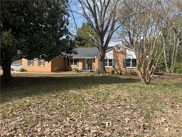 ranch-style house with a front yard