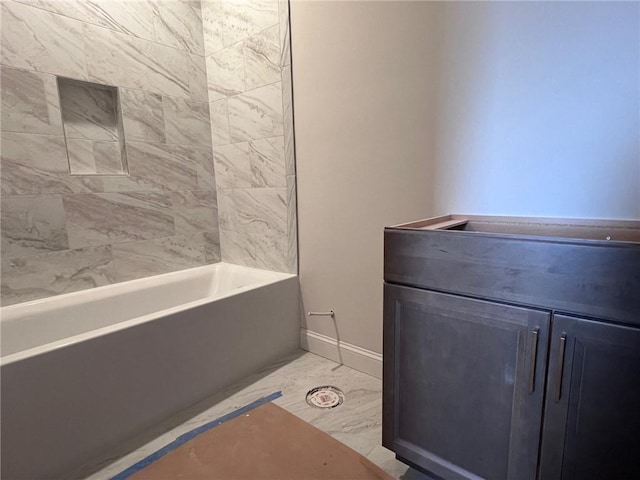 full bathroom featuring marble finish floor and baseboards