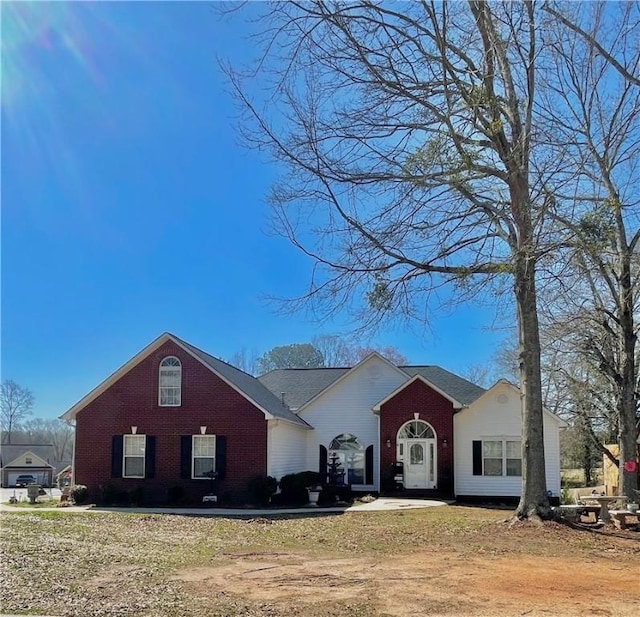 view of front of house featuring brick siding