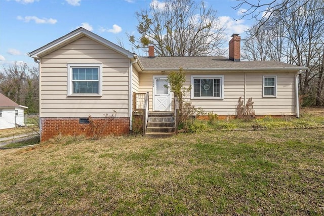 ranch-style house featuring crawl space, a chimney, and a front yard