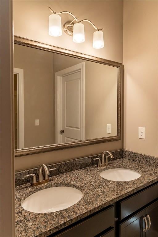 bathroom featuring double vanity and a sink