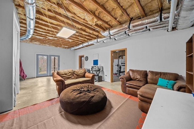 living area featuring concrete flooring and french doors