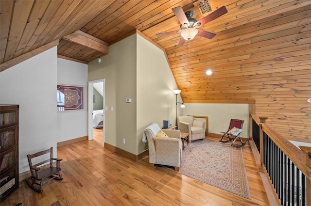 sitting room featuring ceiling fan, vaulted ceiling, wood finished floors, wooden ceiling, and baseboards