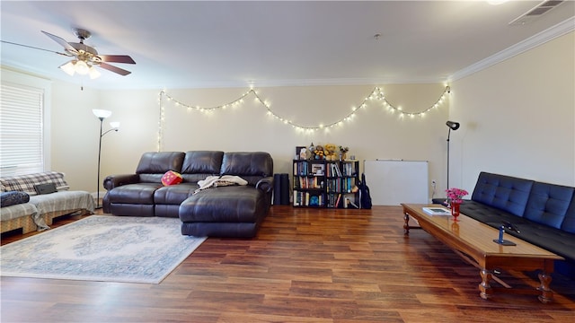 living area with ceiling fan, visible vents, crown molding, and wood finished floors