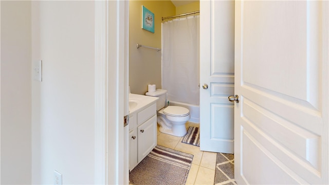 full bath featuring toilet, tile patterned flooring, shower / bath combo, and vanity