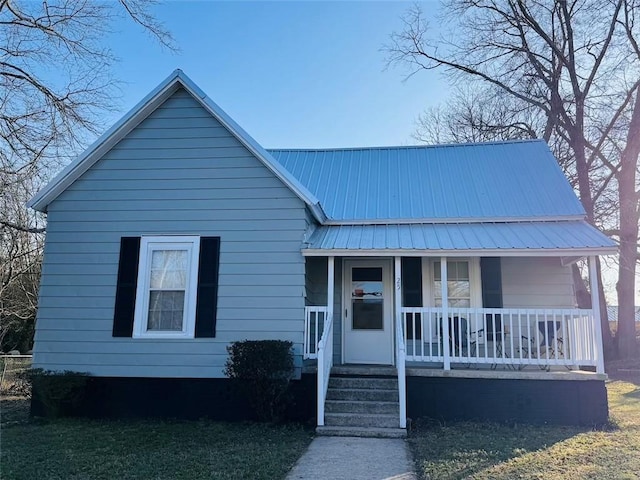 view of front of house with a porch and metal roof