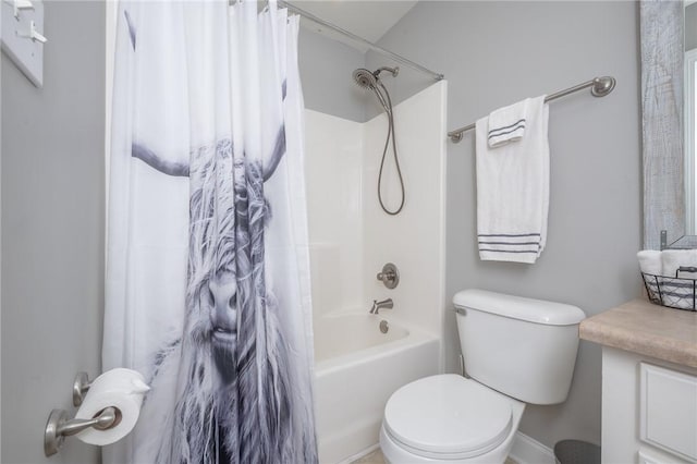 bathroom featuring shower / bath combo with shower curtain, toilet, and vanity