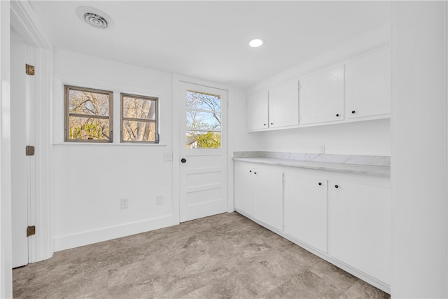 interior space with visible vents and baseboards