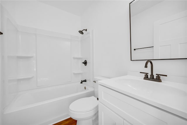 bathroom with toilet, vanity, and washtub / shower combination