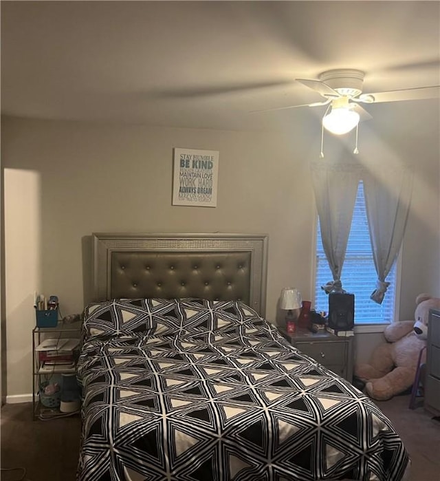 carpeted bedroom featuring a ceiling fan