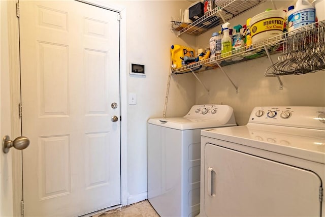 washroom featuring laundry area and washing machine and clothes dryer