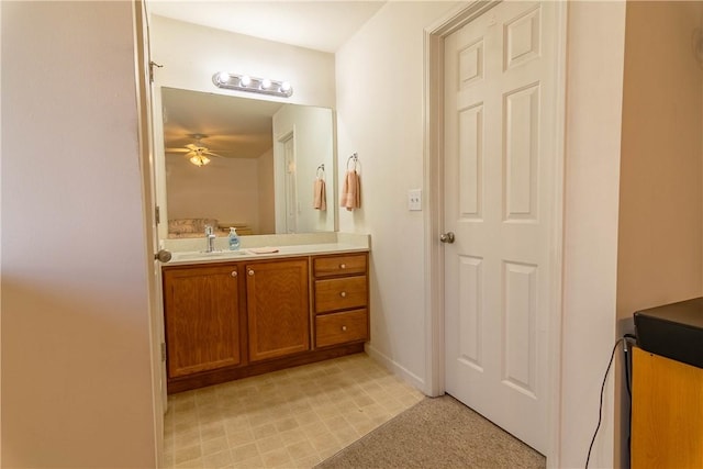 bathroom featuring ceiling fan and vanity