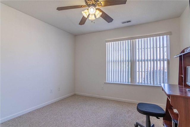 home office with baseboards, visible vents, carpet floors, and ceiling fan