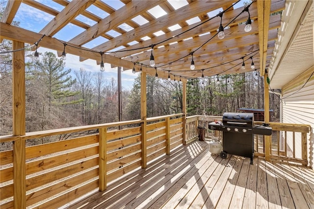 wooden terrace with a pergola and grilling area