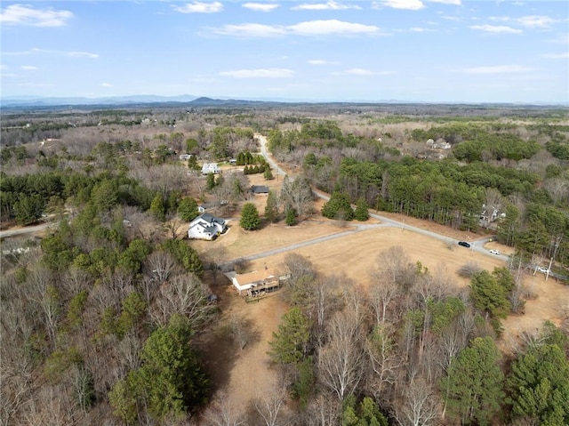 birds eye view of property with a rural view and a forest view